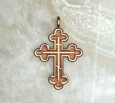 Rose gold or rose gold plated three budded cross with three bar inlay.