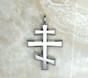 Sterling silver or white gold round beveled three bar orthodox cross.