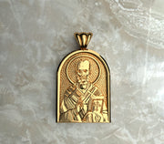 Saints of Christ Orthodox Icon Jewelry – Apse (Dome - Shaped) pendant of the Saint Nicholas of Myra in yellow gold or plated yellow gold. (Front Side)